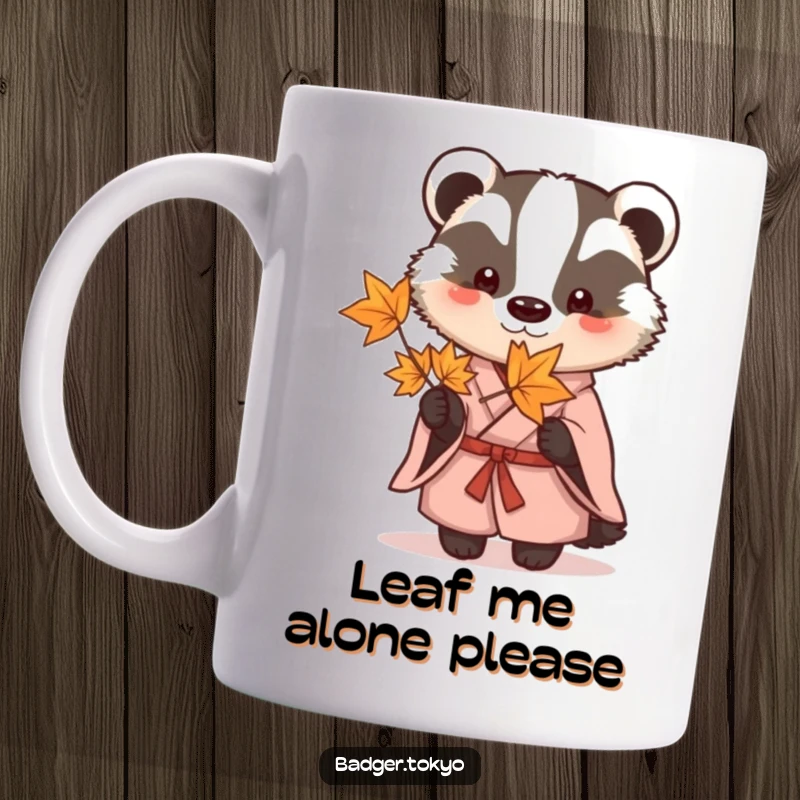 Funny Mug featuring a calm badger in a simple kimono, delicately holding a red maple leaf, conveying peaceful contemplation.