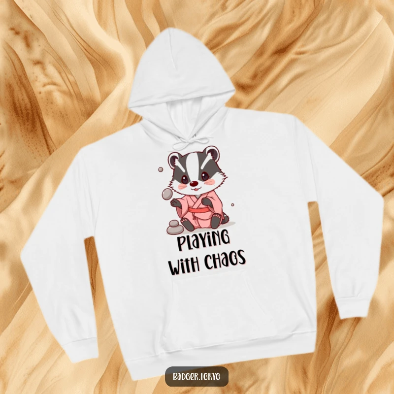 Funny Hoodie: A badger in a simple kimono playfully juggles stones, offering cozy entertainment.